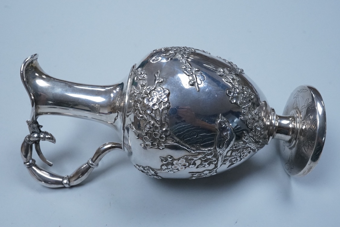 An early 20th century Chinese Export white metal posy vase, by Wang Hing, 18.4cm and a similar ewer by Tien Shing?, lacking cover.